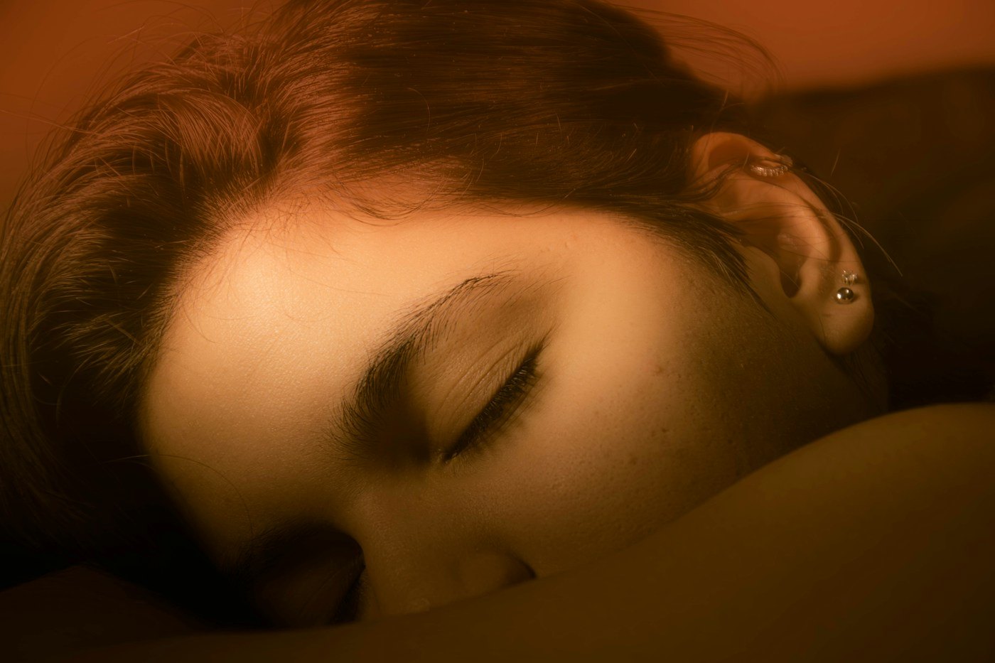 Close view of a woman resting with her eyes closed